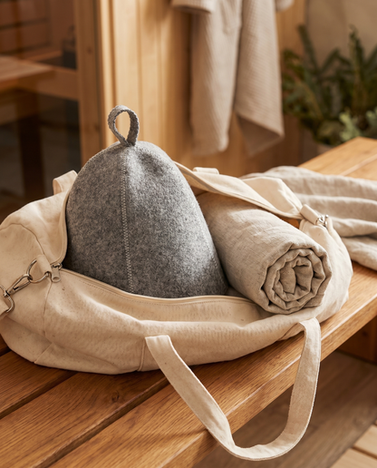 Sawna sauna hat packed in a gym bag with a rolled towel