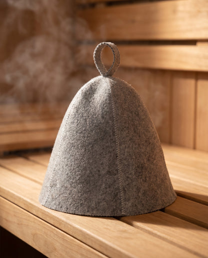 Sawna gray sauna hat resting on a cedar sauna bench